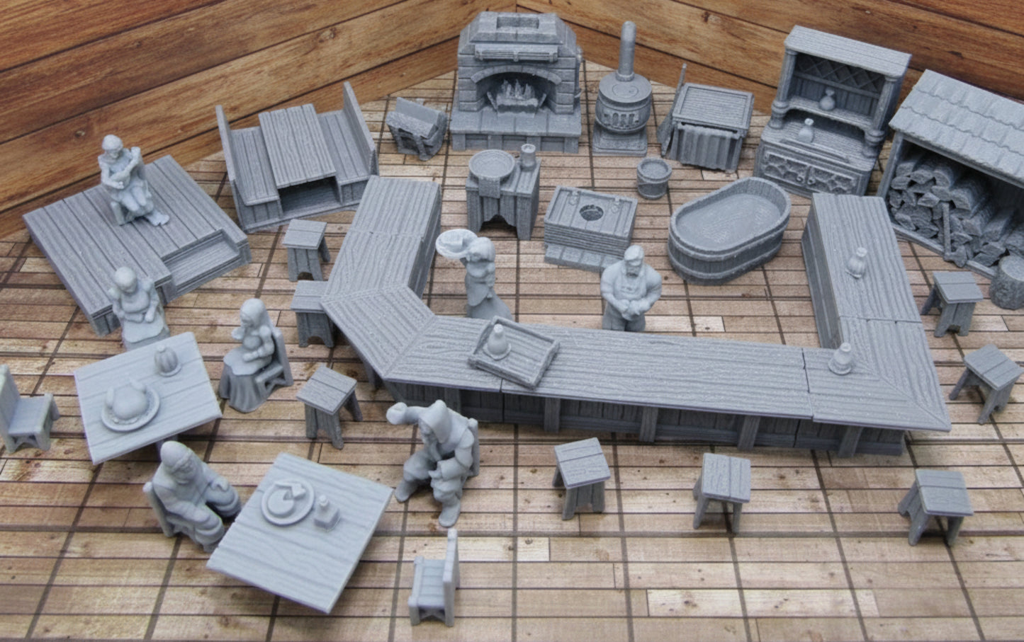 A 50 piece miniature set for Dungeons and Dragons, featuring an inn and tavern scene with patrons, a bar, stools, and a fireplace.